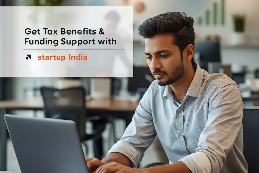 Startup India Registration Benefits showing entrepreneur working in modern office with growth charts and funding support concept